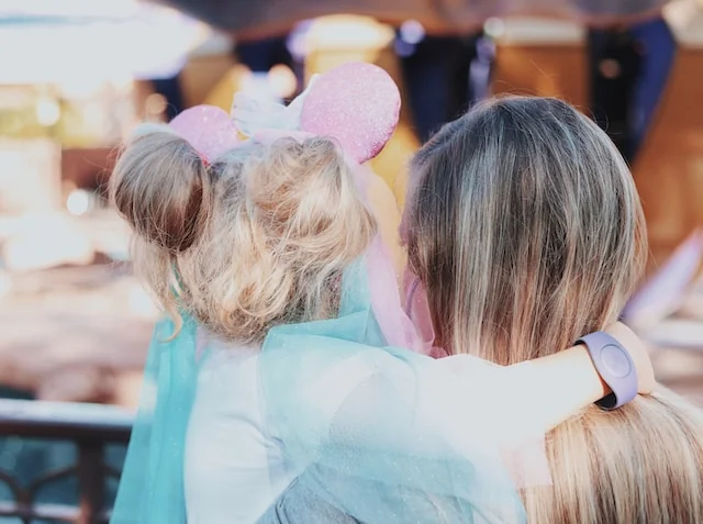 Mum and child looking out over the Disney park